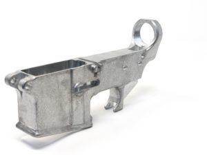 A cast aluminum 80% lower receiver blank with a raw finish.